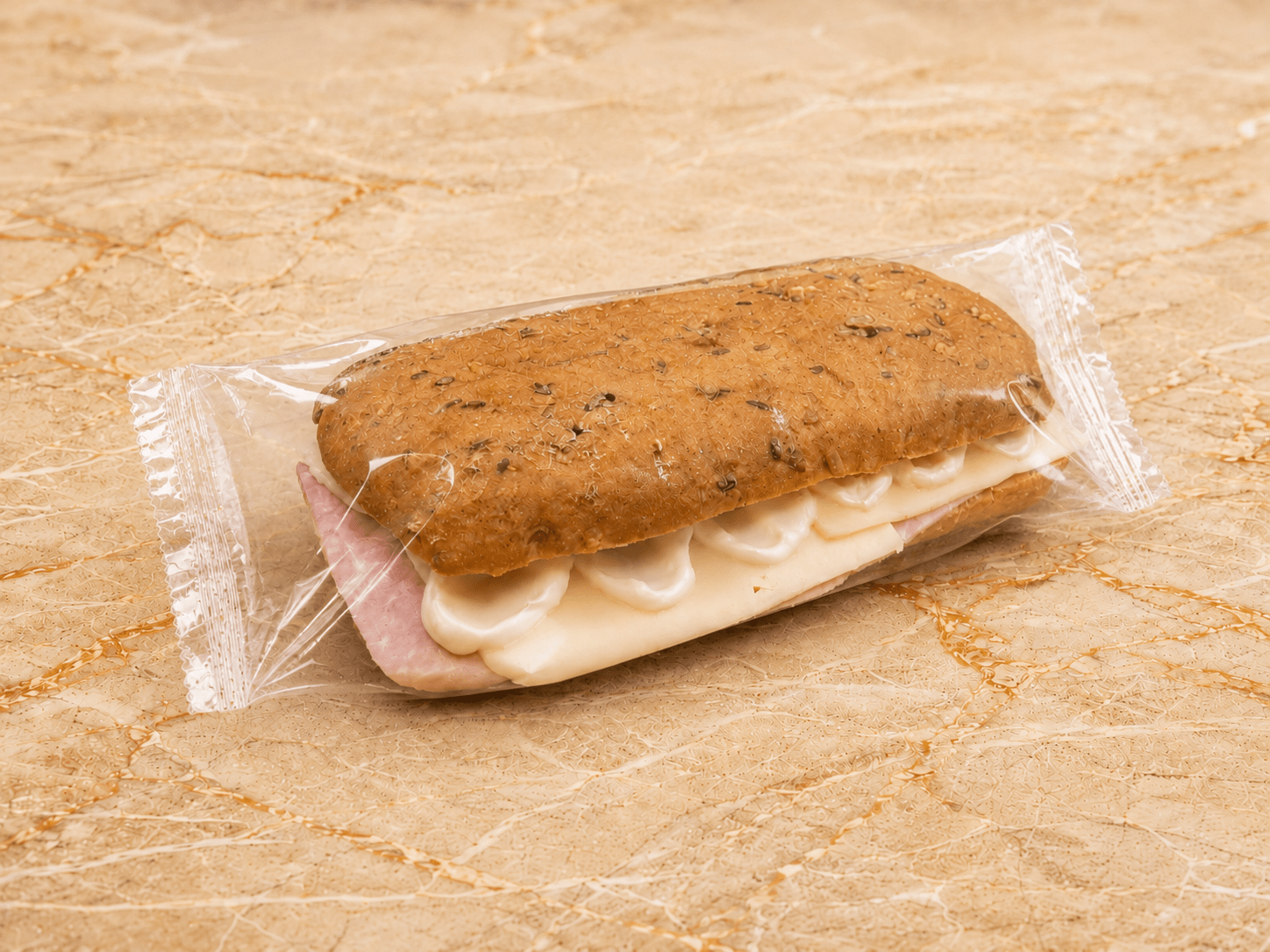 Gluten free dark panini with ham and cheese